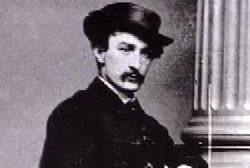 John Wilkes Booth posing with a hat.