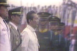 Ferdinand Marcos flanked by 5 military officers
