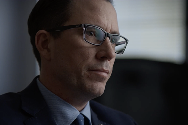 Man in glasses, suit and tie