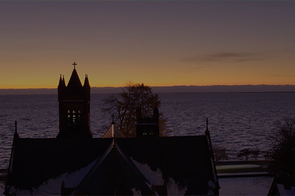 Church with lake in background at sunset