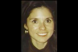 A young woman, Cecilia Newball, with long brown hair and earrings.
