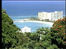 An aerial photo of Sandals Resort in Jamaica, a large white hotel built on the beach.