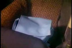 A light blue leather purse is found on a car seat.