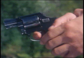 Two hands gripping a small pistol.