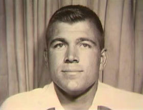 A young caucasian man, Robert Borton, wearing a white shirt and a buzzcut.