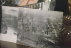 A postcard propped up on the table.