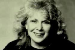 An elderly woman with blonde hair, Anita Green.