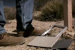 Empty picture frames at the foot of a person