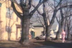Joyce jogging through a suburban neighborhood