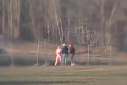 Two young men accosting Joyce in the middle of a field