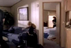 A police investigator examining Larry's bedroom