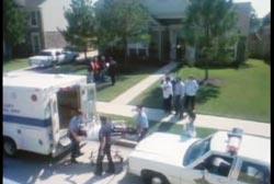 Paramedics and officers wheeling the covered body of Geri onto an ambulance