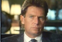 Stephen Geri with blue eyes in a suit and tie 