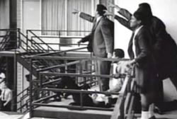 Kings aides pointing in the direction of where martin luther king was shot from