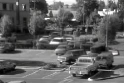 Security camera footage cars in the parking lot