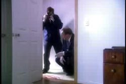 Police investigators taking photos of the blood stained area Mike was dragged through