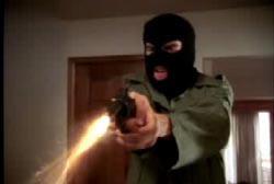 The gunman in skimask shooting his revolver