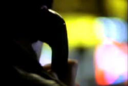 The gunman with a payphone up to his ear