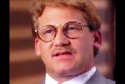 Dannion Brinkley with a small mustache and glasses