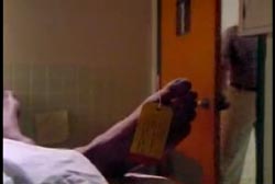 Dannion's covered body with a decesed tag around his foot