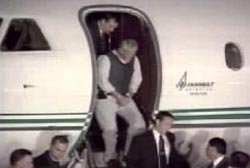 Einhorn being escorted off a plane by police