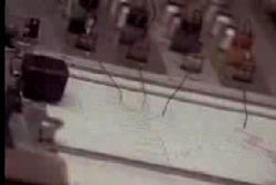 A polygraph machine drawing lines a piece of paper