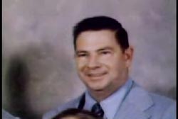 Smiling Pat Conway in a shirt and tie