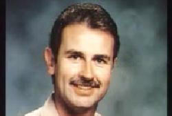 Smiling Charlie Anderson with a mustache