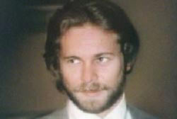 Smiling Don Kemp with beard and suit and tie
