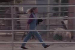 Leroy's sister walking through a farm