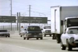 Multiple cars driving down a california highway