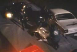 Police arriving at the scene of the crime covering the body of Rae Ann Mossor