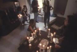 A "cult" metting with a many lit candles