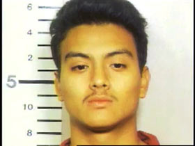 Mug shot of Lionel Luviano with a pencil mustache