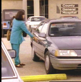 Lionel dressed as his sister opens the door to a getaway vehicle