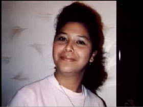 Maria Rosa Hernandez with a smile in a white shirt