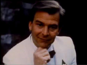 Philip Breen wearing a white tuxedo