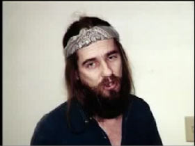 Robert Joos wearing a bandana with long hair and a beard
